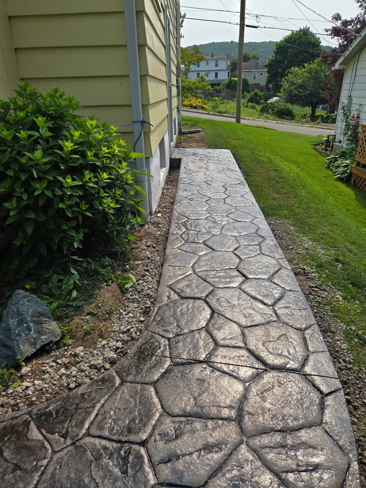 Stone retaining wall with plantings, SKJ Builders Binghamton NY