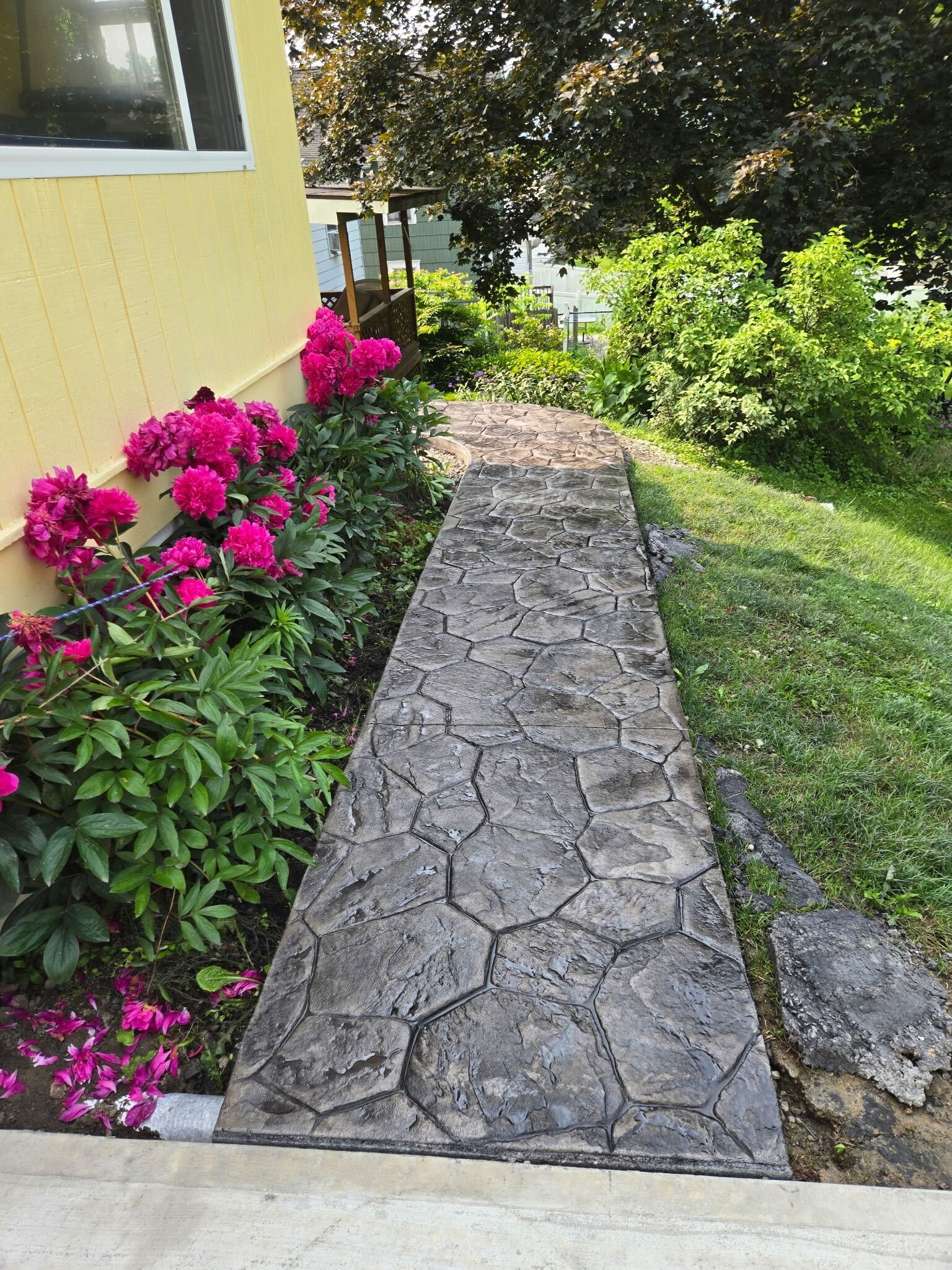 Stamped concrete walkway with flower garden — Southern Tier NY