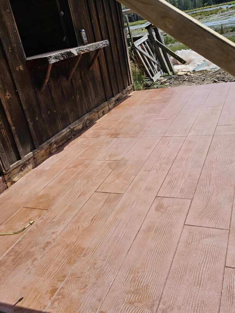 Wood-grain stamped concrete patio — SKJ Builders NY